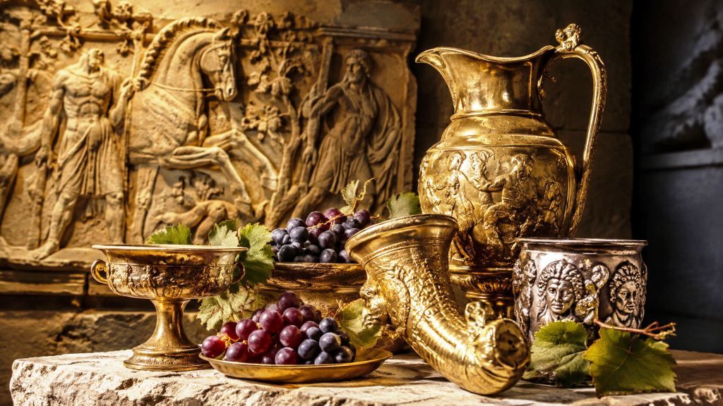 How old is Bulgarian wine really? | Ancient Thracian wine heritage | Bulwine.com Bulgarian wine history illustrated by ancient Thracian gold wine vessels with grapes, reflecting the centuries-old wine culture of Thrace